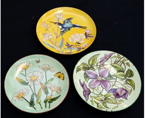 Three late Victorian Aesthetic cabinet plates, each signed by artist H.M.L to include:1. yellow ground decorated with a Kingf