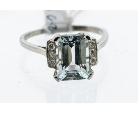 An aquamarine and diamond platinum dress ring, claw  set to the centre with a emerald cut aquamarine, stone weight approx 2.5