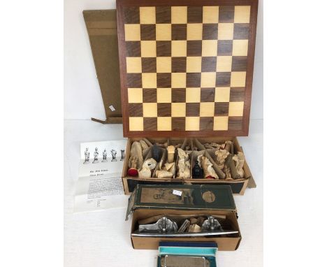 A resin chess set with board, vintage boxed ice skates, German harmonica