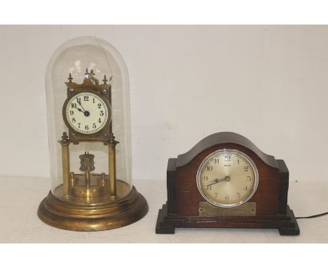 A 1950's German anniversary clock in dome, along with mid 20th Century electric mantle clock