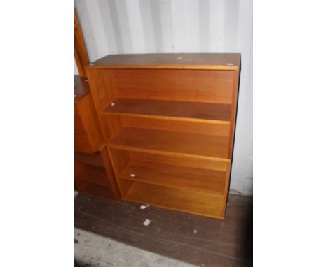 A collection of 1970s teak furniture, comprising three open bookcases, two fitted with a single adjustable shelf, the other f