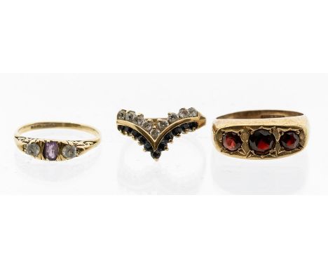 A 9ct gold and blue and white paste set wishbone ring, size O, a 9ct gold amethyst and paste set ring, size N, along with a 9