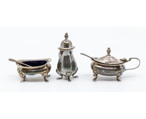 A Georgian style silver three piece condiment set, by Mappin &amp; Webb, Birmingham, 1973, with blue plastic liners, 3.69 ozt