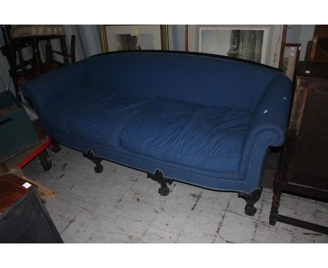 A carved and ebonised mahogany upholstered sofa, possibly French, late 19th Century