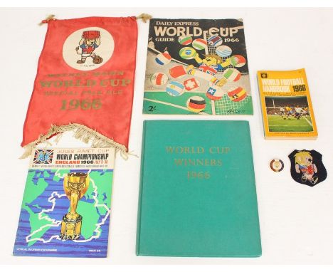 A 1966 World Cup Watney Mann pennant; together with a 1966 World Cup Willie badge, a 1966 World Football Handbook, 1966 World