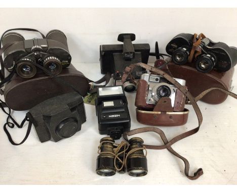 Collection of vintage cameras and binoculars, mostly in cases