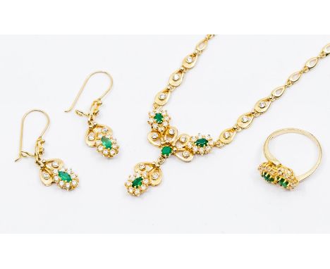 An emerald and cubic zirconia 14ct gold set comprising earrings, necklace and ring, size O1/2, stamped 585, total combined gr