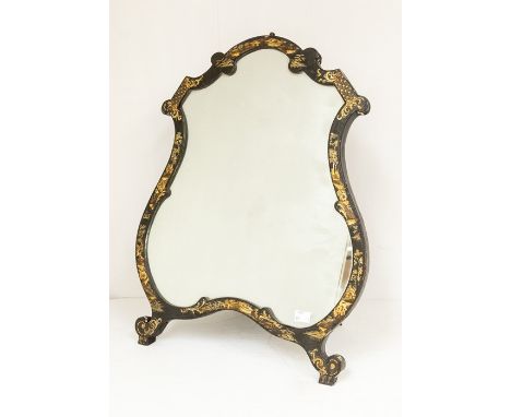 A late Victorian cartouche shaped easel back japanned mirror, on scroll legs&nbsp;