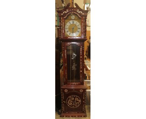 A Chinoiserie mahogany cased longcase clock inlaid with mother-or-pearl decoration, having a musical mechanism