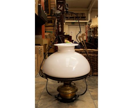A collection of fire side brass wares including horse brasses, other brass items including a ceiling hanging lamp