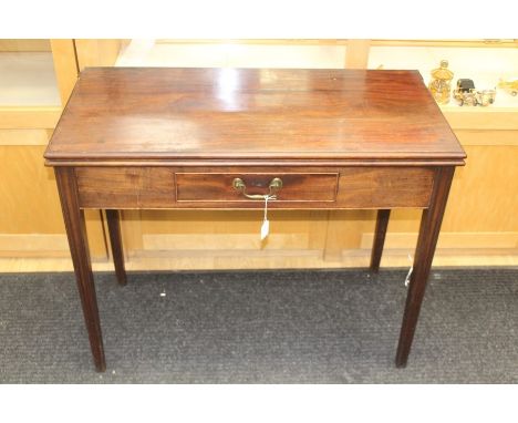 A George III mahogany fold over tea table, fitted with a single drawer, 73cms high, 90cms wide approx together with a Chippen