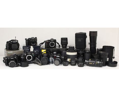 A collection of assorted cameras and lenses to include: Nikon D5300 body; Nikkor 28-200mm 1:3.5-5.6D lens; Sigma 18-200mm F3.