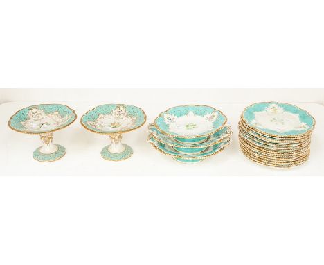 A 19th Century Grainger Worcester dessert service to include 15 plates, pair of raised tazze and three comports, green border