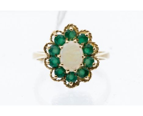 A 9ct gold opal and emerald cluster ring, size P1/2, approx 3.7gmscondition report: all stones present, the opal has a surfac