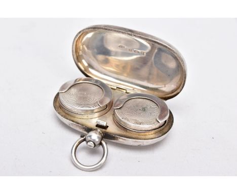 A SILVER DOUBLE SOVEREIGN CASE, of a plain polished pill form, fitted with a suspension ring, opens to reveal two spring coin