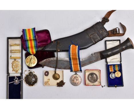 A BOX CONTAINING A TOURIST STYLE SMALL KIKRI KNIFE AND SCABBARD to include medals, badges, masonic style gold coloured medall