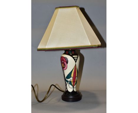 A MOORCROFT POTTERY TABLE LAMP OF BALUSTER FORM, decorated in the Melody pattern by Sian Leeper, with the original shade, hei