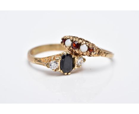 TWO 9CT GOLD GEM SET RINGS, the first designed as a five stone ring set with three graduated circular cut garnets, interspace