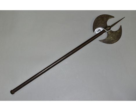 AN ANTIQUE ISLAMIC PERSIAN DOUBLE HEADED AXE, etched decoration, metal shaft, length 66.5cm