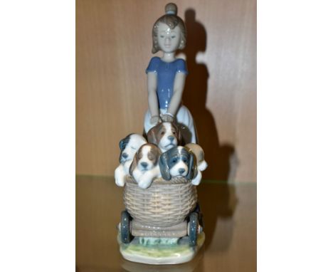 A LLADRO FIGURE GROUP, 'LITTER OF FUN', No 5364, girl pushing a pram full of puppies, sculptor Jose Roig 1986 , retired 2000,