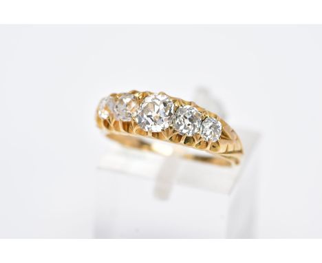 A GOLD VICTORIAN GRADUATED HALF HOOP DIAMOND RING, old cushion cut diamonds graduating in size to engraved shoulders, estimat