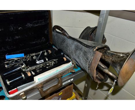 A CASED BUESCHER (USA) ARISTOCRAT CLARINET, brown bakelite with plated mounts, together with a Hawkes &amp; Son silver plated