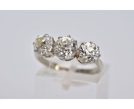 A LATE VICTORIAN TO EARLY TWENTIETH CENTURY THREE STONE DIAMOND RING, centre old cushion diamond estimated weight 1.26cts, th