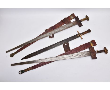 AN ARABIC DESIGN SHORT SWORD, wooden grip with gold coloured metal cross guard, blade has Arabic scrolled design it's entire 