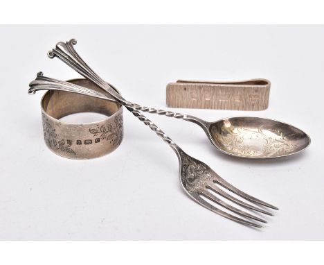 A SILVER FORK, SPOON, NAPKIN RING AND A MONEY CLIP, the silver desert fork and spoon each with a decorative foliate design to