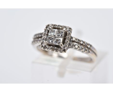 A 18CT WHITE GOLD DIAMOND RING, the head is of a square design, set with four princess cut diamonds, within a round brilliant