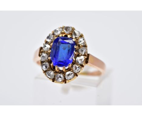 A GOLD ROSE CUT DIAMOND AND BLUE PASTE OVAL CLUSTER RING, estimated rose cut diamond weight 0.75ct, ring size P, approximate 