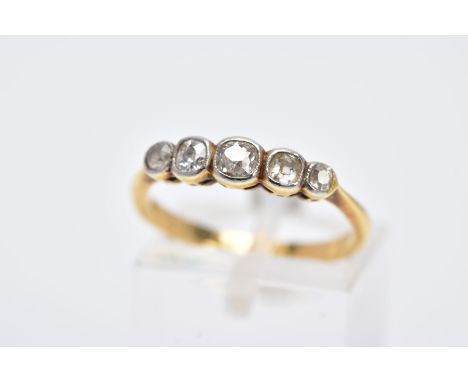 A YELLOW METAL DIAMOND RING, designed with a row of graduated old cushion cut diamonds, each within a worn millegrain setting