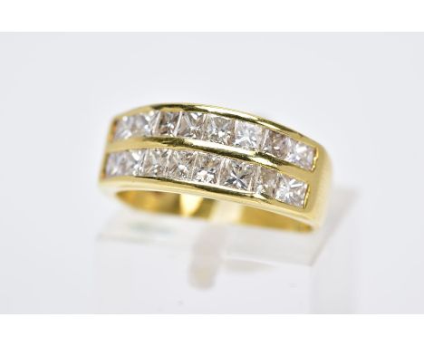 A MODERN 18CT GOLD DOUBLE ROW DIAMOND RING, two rows of princess cut diamonds slightly tapering in size, estimated total diam