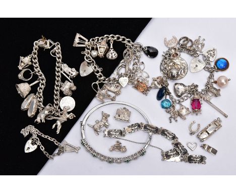 A BAG OF ASSORTED JEWELLERY, to include three white metal charm bracelets suspending charms, one fitted with a silver heart c