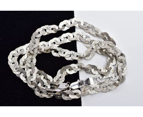 A 9CT WHITE GOLD CHAIN, the textured curb link chain, fitted with a lobster claw clasp, hallmarked 9ct gold Birmingham, lengt