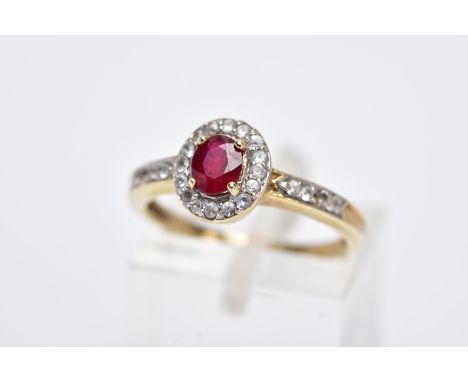 A 9CT GOLD RUBY AND SPINEL CLUSTER RING, designed with a central oval cut ruby within a circular cut colourless spinel surrou