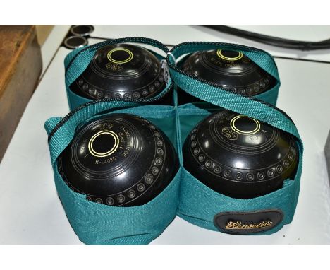 FOUR THOMAS TAYLOR LIGNOID SIZE 4 BOWLS, No M-L4090, have been used but are in fairly good condition, contained in a green ny