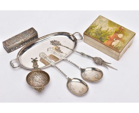 A SELECTION OF ASSORTED CONTINENTAL SILVER ITEMS, to include an oval double handled dish, a tea strainer with a decorative bo