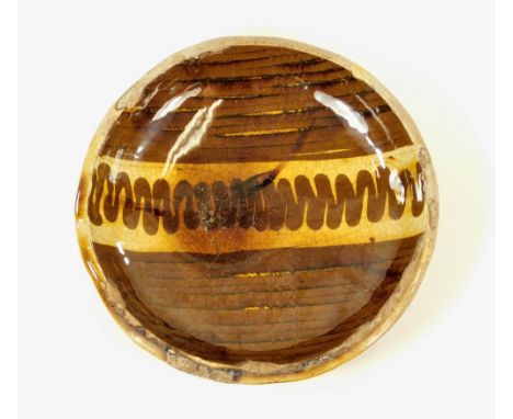 LEACH SLIPWARE. A very early slip decorated Leach Pottery dish, possibly 1920's. Light buff/pink body &amp; impressed Pottery