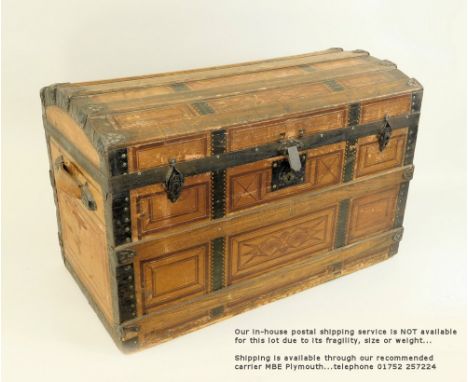 VICTORIAN TRUNK.A Victorian domed trunk, the lid & sides covered with printed paper to simulate panelling. The top & corners 