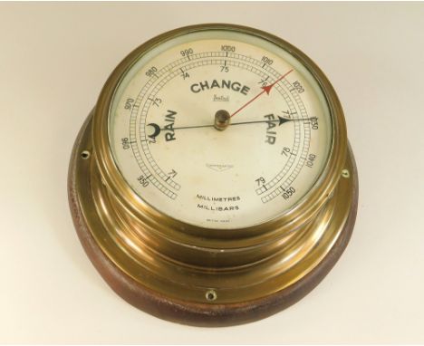 BAROMETER. A Sestrel brass cased bulkhead barometer. Max. diameter 20cm.