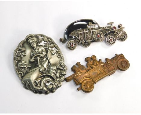 MOTORING BROOCHES.A stamped metal motor car brooch, 6cm, & marcasite & black enamel motor car with moveable wheels & a modern
