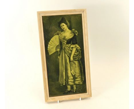 MAJOLICA TILE. A Sherwin &amp; Cotton, olive green majolica glazed picture tile, 'Her First Ball'. 30 x 15cm, framed.
