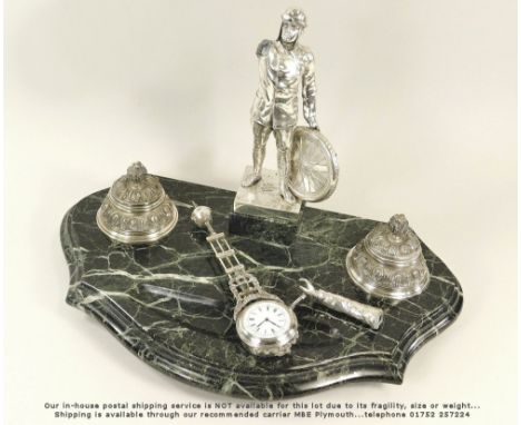 MYSTERY CLOCK.A silver plated spelter motorist mystery clock, set on an associated marble desk stand with silver plated brass