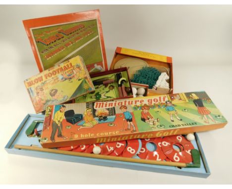 TOY GAMES. A Chad Valley miniature golf game, a B.G.L. table tennis set &amp; a 1950's blow football game by Merit.