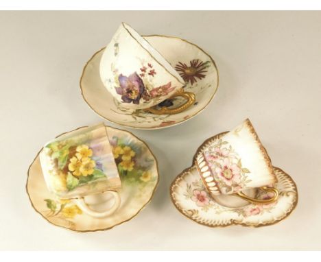 ROYAL WORCESTER ETC. A Royal Worcester cabinet cup &amp; saucer, pattern W 4158. Also two Doulton Burslem cabinet cups &amp; 