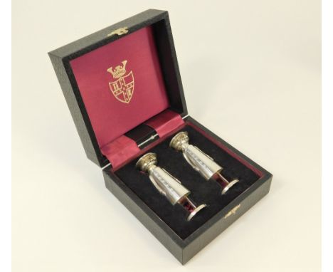 SILVER CONDIMENTS.A pair of silver novelty chauffeur salt & pepper pots, based on the originals in the Royal Automobile Club.