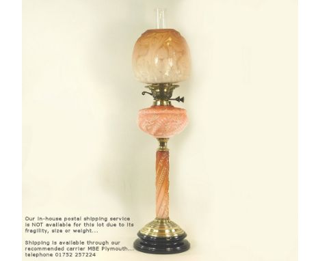 OIL LAMP.A Victorian brass oil lamp with pink glass fount & column & Art Nouveau etched & moulded glass shade. Height 78cm.