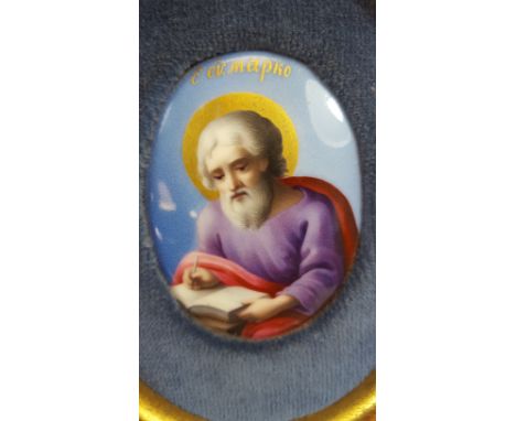 A LATE 19TH CENTURY OVAL RUSSIAN ENAMEL ON COPPER PAINTING OF A SEATED SAINT, dated 1852 to the reverse, 2 1/2 ins x 1 3/4 in