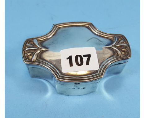 AN EDWARDIAN ART NOUVEAU INFLUENCE SILVER TRINKET BOX of shaped outline, velvet lined, maker:- AJZ, Birmingham 1906.   